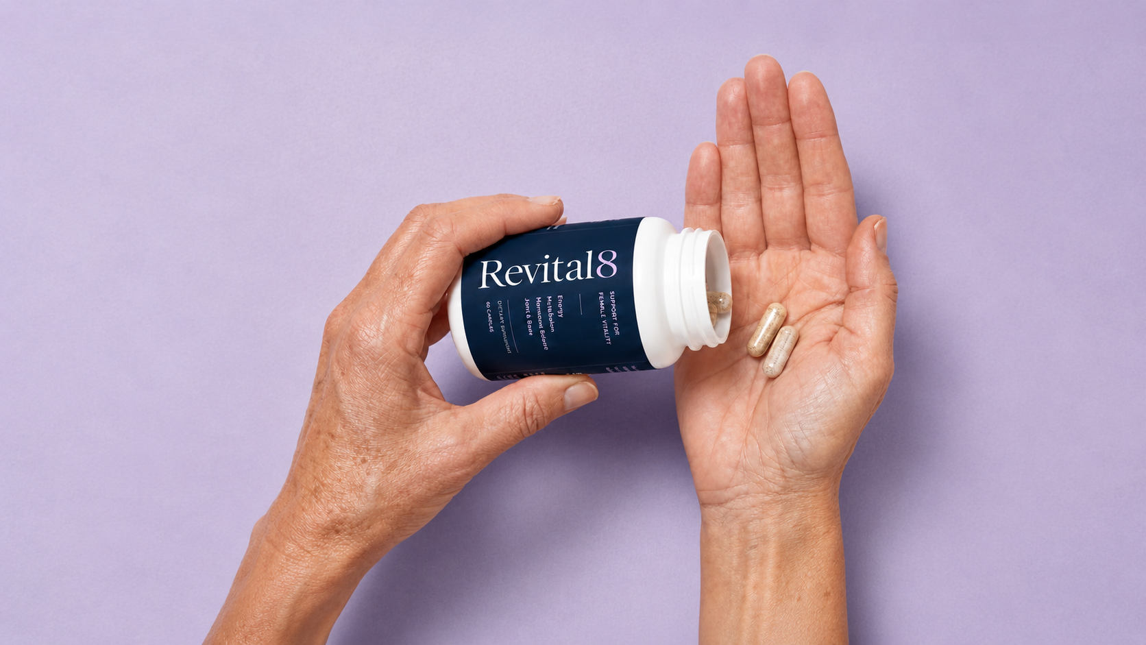 Woman's hand holding Revital8 bottle